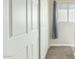 Hallway showing linen closet, carpet, and a small window with blinds at 2812 W Heatherbrae Dr, Phoenix, AZ 85017