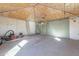 Spacious garage featuring high ceilings and ample room for parking and storage at 3027 N 21St Pl, Phoenix, AZ 85016