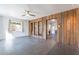 Inviting living room featuring tile floors, wood paneled walls, and bright natural light at 3027 N 21St Pl, Phoenix, AZ 85016