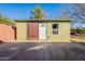 Front exterior of shed with secure metal grate door and white wood door at 3027 N 21St Pl, Phoenix, AZ 85016