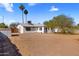 Spacious backyard with palm trees provides potential for customization and outdoor activities at 3031 S Los Altos --, Mesa, AZ 85202