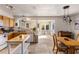 Bright kitchen with wood cabinets and stainless steel appliances flows into the dining area at 3031 S Los Altos --, Mesa, AZ 85202