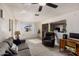 Bright living room with tile floors, ceiling fan, and ample sunlight from the windows at 3031 S Los Altos --, Mesa, AZ 85202