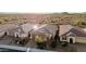 This aerial view of a residential neighborhood offers a sense of community, featuring well-kept homes, and a serene desert setting at 30816 N 138Th Ave, Peoria, AZ 85383