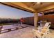 Outdoor living space with ceiling fan, pavers, and a built-in grill at 30816 N 138Th Ave, Peoria, AZ 85383