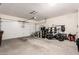 Spacious garage with ample storage, including shelving units, bikes, and organized equipment, providing functional space at 30816 N 138Th Ave, Peoria, AZ 85383