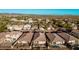 An aerial view of a desert neighborhood showcasing diverse home styles and mountain vistas at 30816 N 138Th Ave, Peoria, AZ 85383