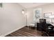 Well lit home office with dark floors and plantation shutters at 30816 N 138Th Ave, Peoria, AZ 85383