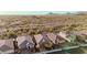 An aerial shot of multiple residences within a desert community featuring mountain views at 30816 N 138Th Ave, Peoria, AZ 85383