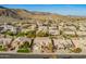 Aerial view of the property in a desert neighborhood and mountain views at 3144 E Desert Broom Way, Phoenix, AZ 85048