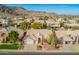 Aerial view of single Gathering home features mature landscaping and mountain views at 3144 E Desert Broom Way, Phoenix, AZ 85048