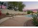 Spacious backyard with a pool, patio, and privacy wall for outdoor enjoyment at 3144 E Desert Broom Way, Phoenix, AZ 85048