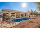 Backyard featuring a pool, covered patio, and well-manicured landscaping at 3144 E Desert Broom Way, Phoenix, AZ 85048