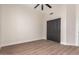 Bedroom features a ceiling fan, sliding closet doors, and tile flooring at 3144 E Desert Broom Way, Phoenix, AZ 85048