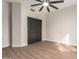 Bedroom with sliding closet door, ceiling fan, and tile flooring at 3144 E Desert Broom Way, Phoenix, AZ 85048