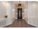 Bright entry way featuring hard wood floors, neutral walls, and modern chandelier at 3144 E Desert Broom Way, Phoenix, AZ 85048