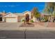 Well-maintained home with a large driveway, two-car garage, and professionally landscaped yard at 3144 E Desert Broom Way, Phoenix, AZ 85048