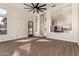 Open living room showcasing tile flooring, a large ceiling fan, and an open layout at 3144 E Desert Broom Way, Phoenix, AZ 85048