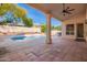 Relaxing covered patio overlooking a pool, perfect for enjoying outdoor living at 3144 E Desert Broom Way, Phoenix, AZ 85048