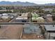 Aerial perspective of a home with solar panels, nestled in a colorful neighborhood at 318 E Hill Dr, Avondale, AZ 85323