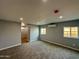 A modern bedroom featuring neutral grey walls, plush carpet, and a ductless air conditioner for personalized comfort at 318 E Hill Dr, Avondale, AZ 85323