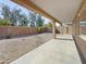 Covered patio overlooking a low maintenance gravel and stone filled backyard at 3201 W Five Mile Peak Dr, San Tan Valley, AZ 85144