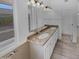 Elegant primary bathroom with granite countertop vanity, dual sinks, and modern fixtures at 3313 N Lakeshore Ct, Avondale, AZ 85392