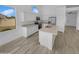 Bright kitchen with granite countertops, stainless steel appliances, and a functional island at 3313 N Lakeshore Ct, Avondale, AZ 85392