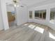 Light-filled living area features bright windows for natural light and wood look flooring at 3313 N Lakeshore Ct, Avondale, AZ 85392