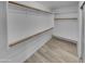 Large walk-in closet with ample shelving and hanging space for organization and storage at 3313 N Lakeshore Ct, Avondale, AZ 85392