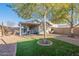 Lush backyard with a covered patio, well-maintained landscaping, and a private outdoor space at 34734 N Happy Jack Dr, San Tan Valley, AZ 85144