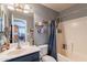 A full bathroom featuring a shower, bathtub, vanity, and tiled floor at 34734 N Happy Jack Dr, San Tan Valley, AZ 85144