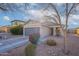 Charming single-story home featuring a gray garage door, neutral exterior paint, and low-maintenance desert landscaping at 34734 N Happy Jack Dr, San Tan Valley, AZ 85144