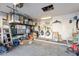 A cluttered garage featuring a washer, dryer, storage shelves, and various household items at 34734 N Happy Jack Dr, San Tan Valley, AZ 85144