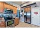 Stylish kitchen featuring stainless steel appliances, tile backsplash, and ample cabinet space at 34734 N Happy Jack Dr, San Tan Valley, AZ 85144