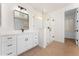 Stylish bathroom with a glass-enclosed shower, a large mirror, and a modern vanity at 3557 S Halsted Ct, Chandler, AZ 85286