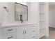 Elegant bathroom vanity featuring a black faucet, shelving, and a large mirror at 3557 S Halsted Ct, Chandler, AZ 85286