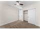 Bedroom with carpet flooring, a ceiling fan, and a closet at 3557 S Halsted Ct, Chandler, AZ 85286