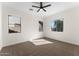 Bedroom features neutral carpet, ceiling fan and backyard views from its windows at 3557 S Halsted Ct, Chandler, AZ 85286