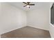 A bedroom with neutral carpet and a ceiling fan at 3557 S Halsted Ct, Chandler, AZ 85286