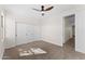 Bedroom with carpet flooring and neutral walls featuring a closet and a modern ceiling fan at 3557 S Halsted Ct, Chandler, AZ 85286