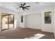 This bedroom features a sliding glass door, a ceiling fan, and an alcove at 3557 S Halsted Ct, Chandler, AZ 85286