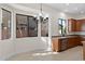 A dining space with a chandelier and windows overlooking the backyard at 3557 S Halsted Ct, Chandler, AZ 85286