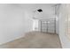 Clean garage interior featuring white walls, concrete floor, and an automatic garage door at 3557 S Halsted Ct, Chandler, AZ 85286