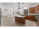 Kitchen with granite countertops and stainless steel appliances, view into living room at 3557 S Halsted Ct, Chandler, AZ 85286