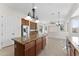 A kitchen featuring an island with granite countertops and a view of the Gathering room at 3557 S Halsted Ct, Chandler, AZ 85286