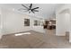 View of the living room looking into the kitchen, with many windows at 3557 S Halsted Ct, Chandler, AZ 85286