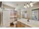 A bathroom with a tile floor, bathtub, and a single sink vanity at 4439 E Coyote Wash Dr, Cave Creek, AZ 85331