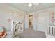 Bright Bedroom with white furniture, soft carpet, and a colorful balloon-themed wall mural at 4439 E Coyote Wash Dr, Cave Creek, AZ 85331