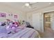 Carpeted bedroom with ceiling fan, natural light, and fun decor at 4439 E Coyote Wash Dr, Cave Creek, AZ 85331